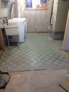 The laundry room with its wonderful linoleum floor and wood panels (the wall separating the laundry room from the main room is now gone).