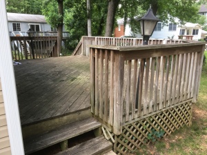 The side stairs - you can see the stains on the deck and just the overall not good shape it is in